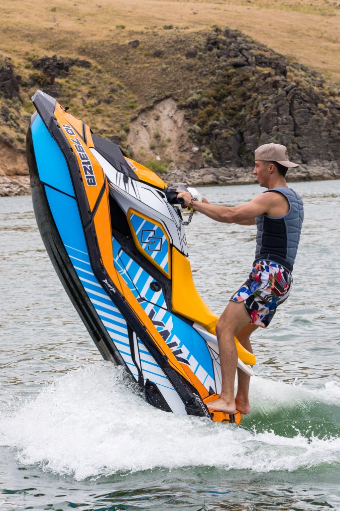 jet ski wrapped in Deviant Ink’s Abstract 1 design with orange, blue, and white geometric graphics
